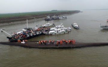Rescue workers search for a sunken ship at the Jianli section of the Yangtze River in Hubei Province, China, on June 2.