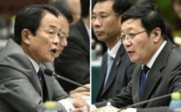 Chinese Finance Minister Lou Jiwei (at right) and Japanese counterpart, deputy Prime Minister Taro Aso (left) during the talks held in Beijing on June 6.
