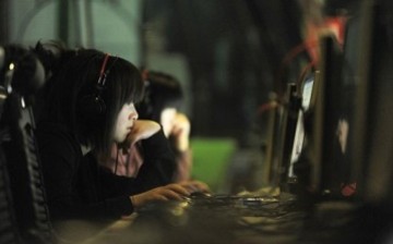 Young people seen surfing the Web at an Internet cafe in Beijing.