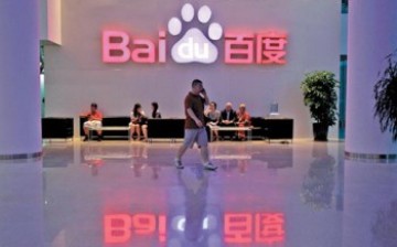 A visitor walks past the lobby of Baidu headquarters in Beijing. 