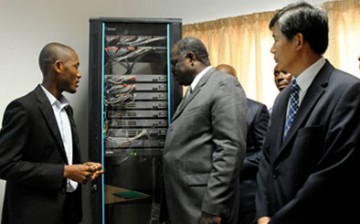 Ghana officials look over an equipment for ICT given by Huawei for its ICT laboratory.
