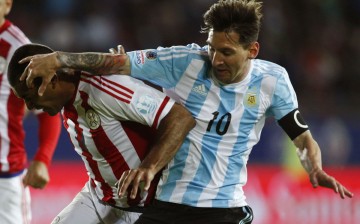 Argentina's Lionel Messi got entangled with Paraguay's Paulo Da Silva during their Copa America 2015 opener.