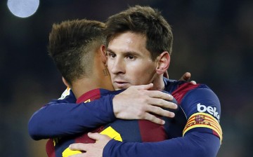 Argentina's Lionel Messi (R) embraces Barça teammate Neymar of Brazil.