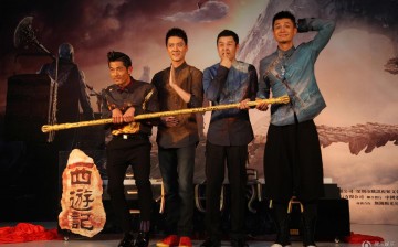 “Monkey King 2” cast members Aaron Kwok (left) and Feng Shaofeng (second from left) pose for the press during a press conference.