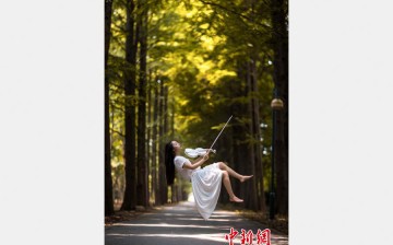 Xiao Ge takes amazing shots of herself floating in the air. Xiao Ge is a dancer from POLE 11, China's first pole dance girl group.