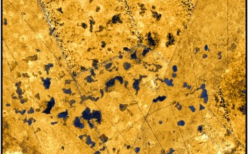 Close-up radar image showing both empty and liquid-filled depressions (coloured blue) on Saturn’s largest moon, Titan.