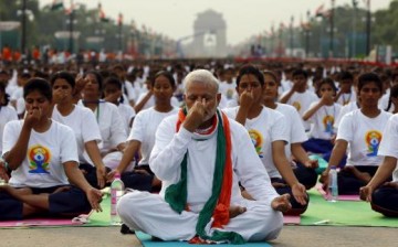 Prime Minister Narendra Modi and Indian youth doing yoga.