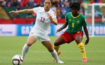 China's 1-0 win vs. Cameroon booked their way to the quarter-finals.