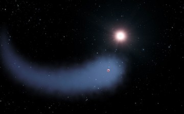 This artist's concept shows the enormous comet-like cloud of hydrogen bleeding off of the warm, Neptune-sized planet Gliese 436b just 30 light-years from Earth.