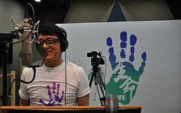 Jackie Chan having fun as he records the song 