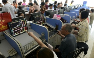 Investors looking at stocks information in Anhui Province, China.