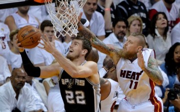 Tiago Splitter goes up for a shot past the Miami Heat's Chris Andersen in the 2014 NBA Finals.