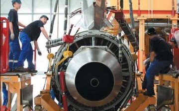 Employees work on an Airbus SAS A320 airplane at the company's plant in Tianjin. 