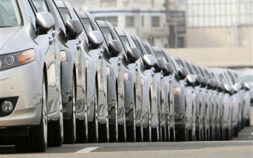 Newly produced cars are parked at a port in Yokohama, south of Tokyo, April 1, 2010.