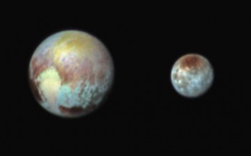 This July 13, 2015, image of Pluto and Charon is presented in false colors to make differences in surface material and features easy to see