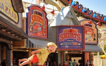 Wil Lawrence, is shown flying in Disneyland, one of the many creative snapshots taken by his doting father Alan Lawrence, who has launched a campaign to share knowledge and insights about Down's Syndrome.