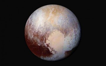 This NASA's photo of Pluto was made from four images from New Horizons' Long Range Reconnaissance Imager (LORRI) combined with color data from the Ralph instrument in this enhanced color global view.
