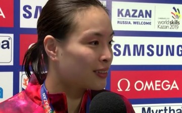 Wu Minxia gets interviewed after her win.