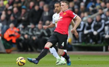 Manchester United's Phil Jones (in red)
