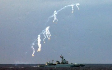 A PLA warship launches missiles during a live-ammunition military drill in the South China Sea, Hainan Province, on July 26, 2010.
