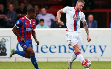 Newly-signed striker Connor Wickham (R) improves Crystal Palace's offense this season.