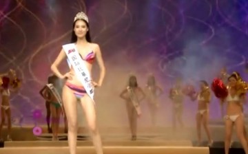 A contestant is presented to the audience during the 37th Miss Bikini International Pageant Henan Division held in 2012.