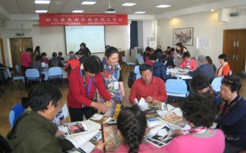 Parents do a group activity during a workshop.