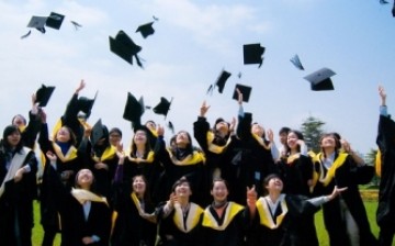 Graduates of Renmin University celebrate during their graduation, part of the hordes of new graduates that compete for jobs every year.