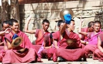 Monks from Labrang Monastery practice their musical skills. 