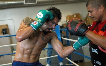 Antonio Margarito works mitts with trainer Robert Garcia