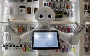 Taiwan's Asustek Computer is set to release its humanoid in 2016, similar to SoftBank's Pepper, shown here displayed in a store in Tokyo last year.