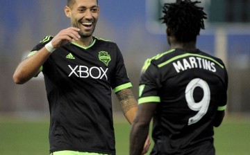 Seattle Sounders' Clint Dempsey (L) and Obafemi Martins.