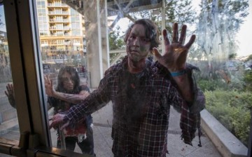 People dressed like zombies take part in The Walking Dead Escape experience at Petco Park during the 2015 Comic-Con International Convention in San Diego, California July 10, 2015.