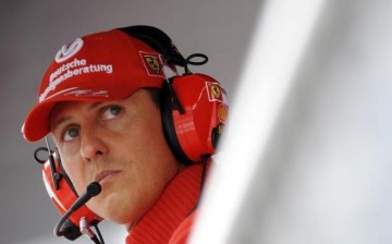 Former Ferrari driver Michael Schumacher of Germany looks on during the qualifying session for the Italian F1 Grand Prix race at the Monza racetrack in Monza, near Milan, in this September 13, 2008 file photo. 