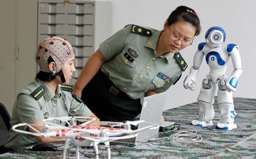 Chinese scientists have develop a mind-controlled robotic suit.