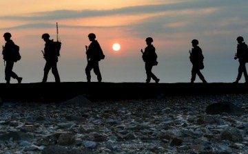 South Korean Marines patrol along a bank of a shore on Yeonpyeong island just south of Northern Limit Line (NLL), South Korea, August 23, 2015.