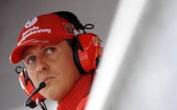 Former Ferrari driver Michael Schumacher of Germany looks on during the qualifying session for the Italian F1 Grand Prix race at the Monza racetrack