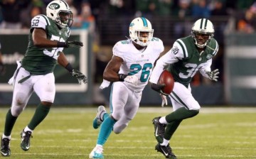 Miami Dolphins runningback Lamar Miller (middle)