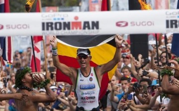 Frederik Van Lierde of Belgium celebrates after winning the Ironman World Championship in Kailua-Kona, Hawaii, Oct. 12, 2013.