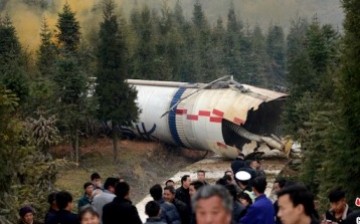 Villagers look at the rocket debris that fell after a launch on Dec. 2014, near Fuquan, a small city in Guizhou Province, more than 300 miles east of the Xichang Satellite Launch Center.