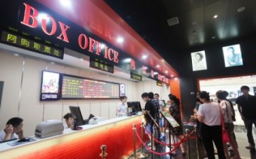 People line up to buy tickets at a cinema in Xuchang, Henan Province.