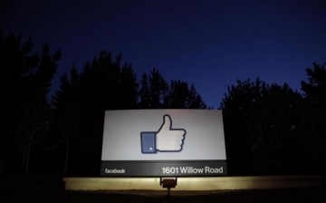 The entrance sign to Facebook headquarters in Menlo Park, California, is lit up in this May 18, 2012 file photo.
