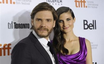 Cast member Daniel Bruehl poses on the red carpet with girlfriend Felicitas Rombold before a screening of the film ''Rush'' at Roy Thomson Hall during the 38th Toronto International Film Festival in Toronto September 8, 2013.