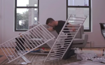 Ryan Reynolds tries to assemble baby crib.