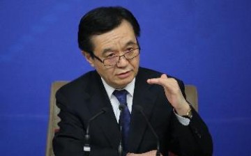 Commerce Minister Gao Hucheng answers questions during a press conference for the third session of China's 12th National People's Congress in Beijing, March 2015.