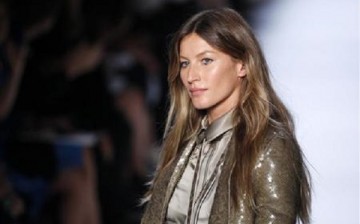 Model Gisele Bundchen presents designs by Italian designer Riccardo Tisci in Paris