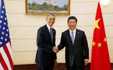 U.S. President Barack Obama shakes hands with President Xi Jinping during a meeting in Russia in 2013.