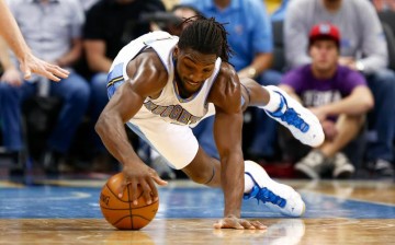 Denver Nuggets power forward Kenneth Faried diving for a loose ball.