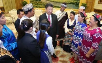 President Xi Jinping meets with 13 outstanding grassroots ethnic solidarity representatives at the Great Hall of the People in Beijing.