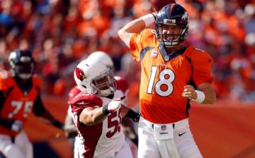 Denver Broncos quarterback Peyton Manning (#18).